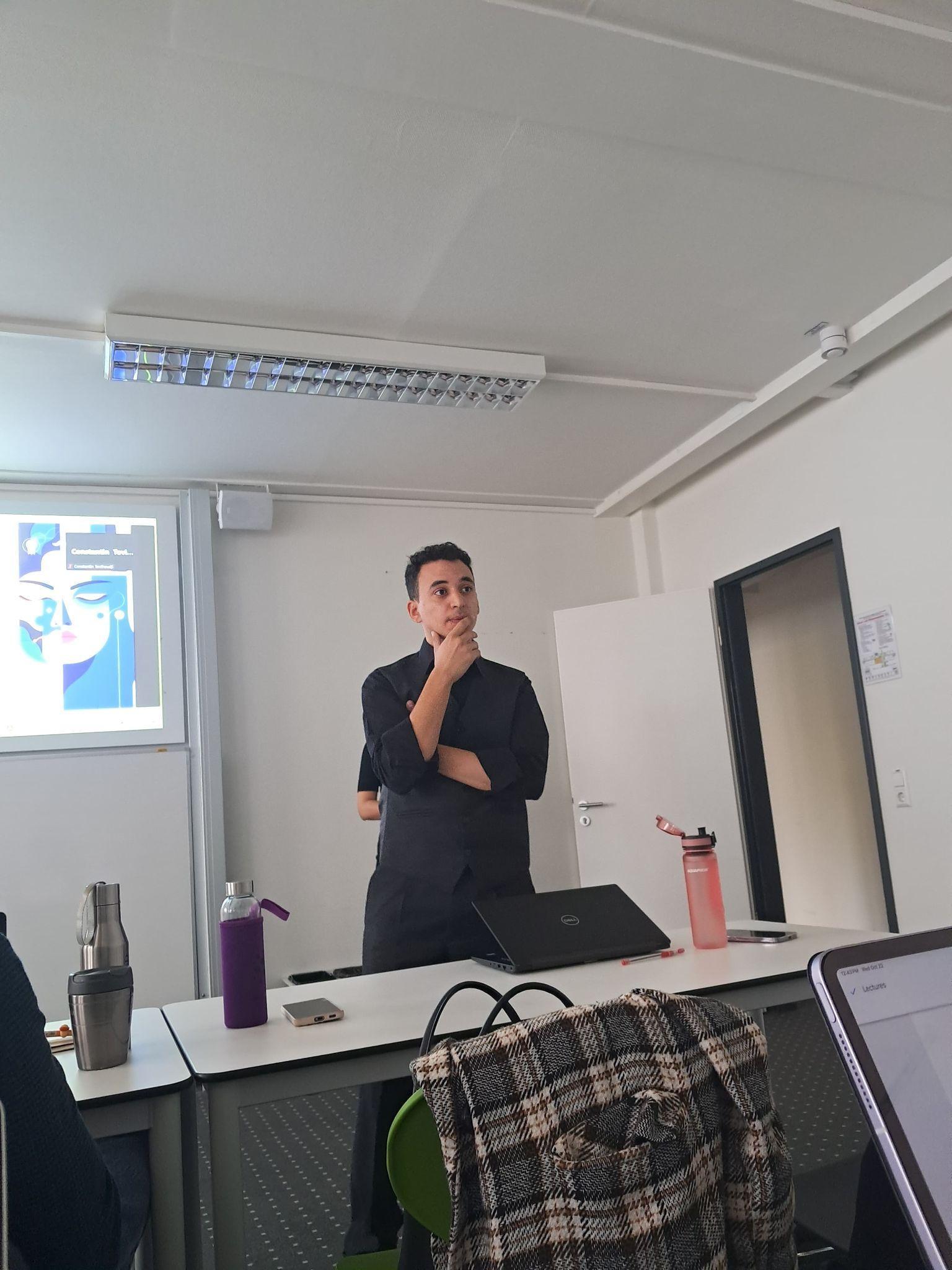 Youssef Farouk standing at the front of a classroom
