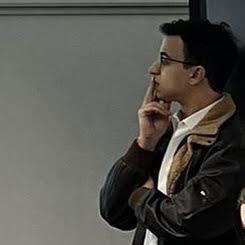 Youssef Farouk in glasses, deep in thought